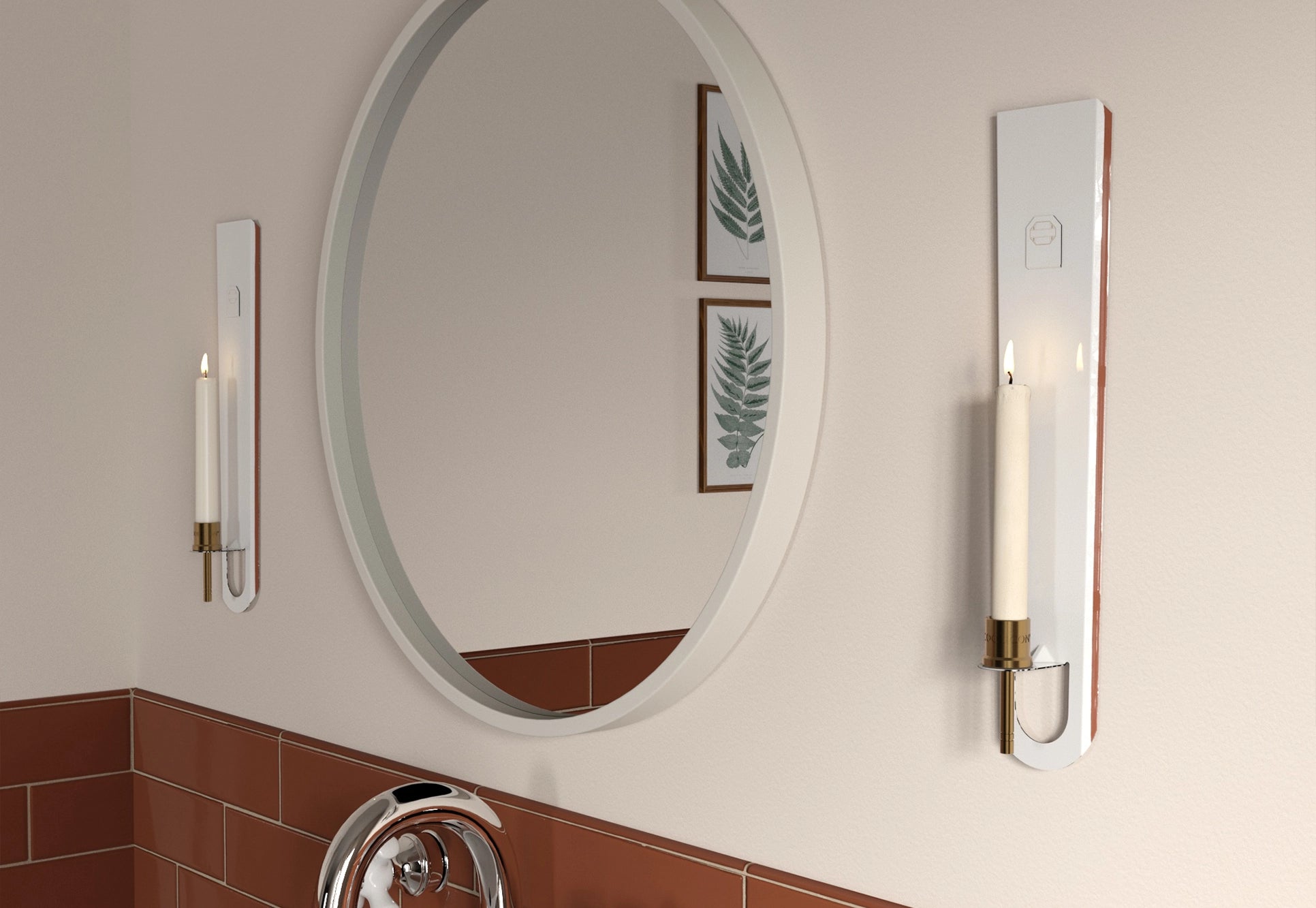 wo candle sconce with a lit candle in a bathroom, next to a mirror