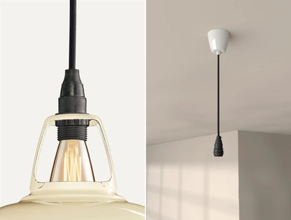 Close up of an E14 Industrial suspension set on a Classic Cream lampshade on the left. On the right, an E14 Industrial pendant set is is hanging from the ceiling
